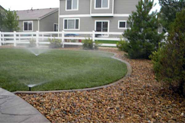 New landscaping and sprinklers